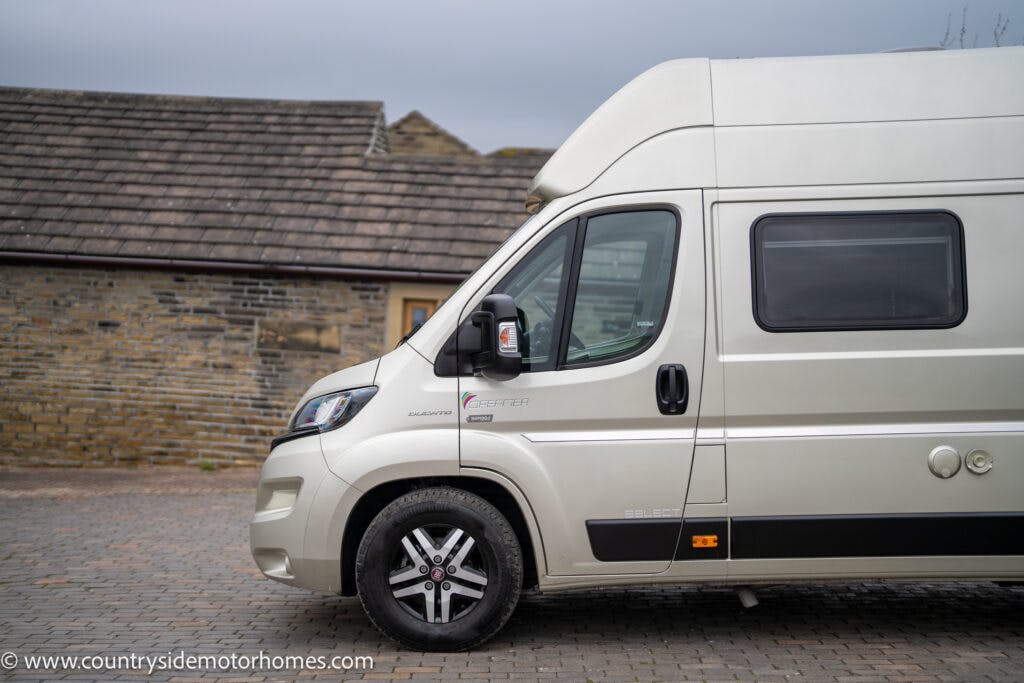 A 2020 Rapido Dreamer Select Campervan XL with a high roof is parked on a cobblestone driveway in front of a stone building with a tiled roof. The website "www.countrysidemotorhomes.com" is visible in the bottom left corner of the image.